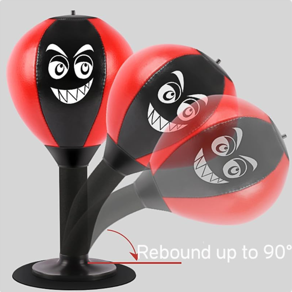 Red and black boxing bag with cartoon face design on a gray background