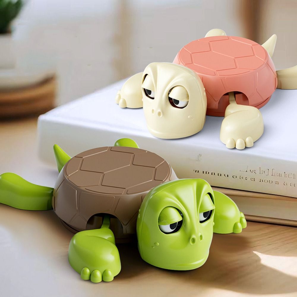 Two turtle coaster on a surface with books in the background